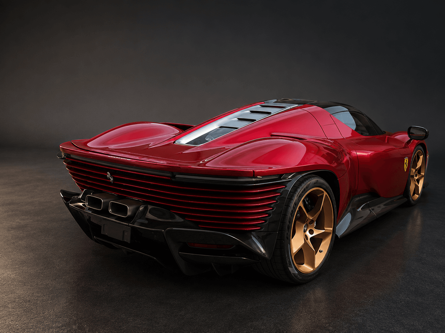 Sleek red Ferrari Daytona SP3 featuring gold wheels and a distinctive horizontal slatted rear.